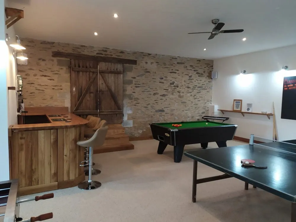 Gite Bar for Drinks, This exceptional holiday home combines charm with modern comfort. The villa features multiple bedrooms, each tastefully decorated to provide a peaceful retreat. The cozy living area, complete with a traditional log burner, ensures warmth and ambiance for cooler evenings. For larger groups, extra beds are available to ensure everyone enjoys a comfortable stay.

The villa’s facilities are second to none. A stunning private pool invites you to cool off during sunny afternoons, while the hot tub provides a luxurious way to unwind. The villa also offers a sauna, perfect for a spa-like experience in the comfort of your holiday home.