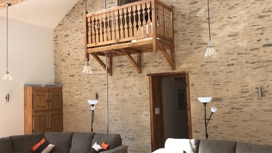 Lounge with firemans pole and balcony