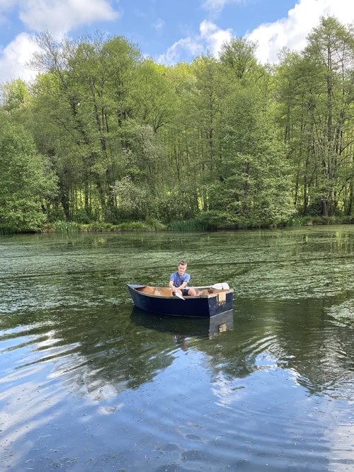 Boy in a boat in the lake