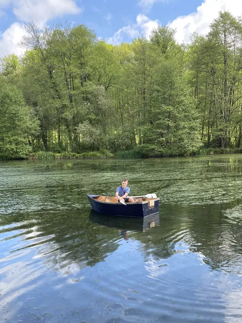 Boy in a boat in the lake