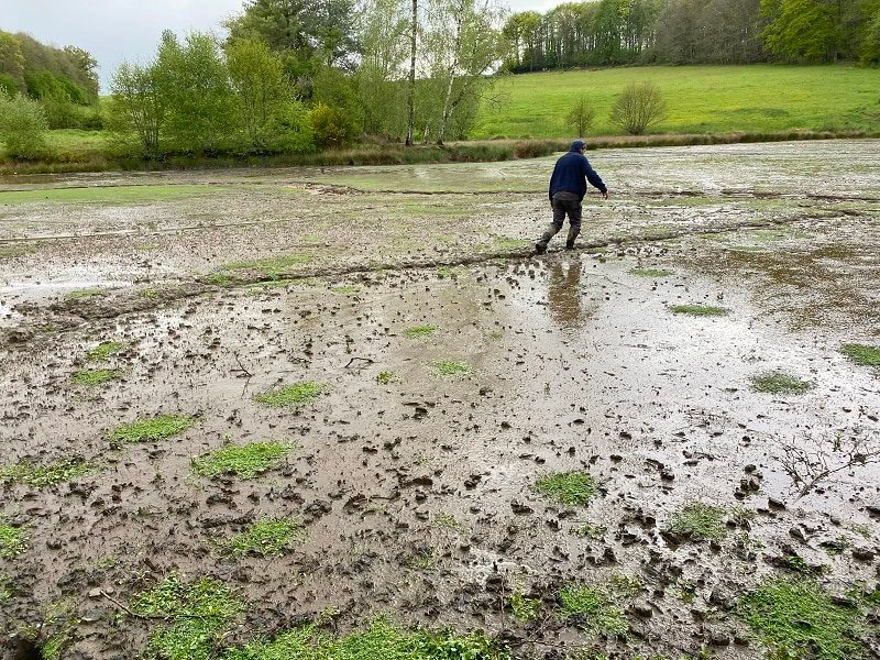 Xav walking across the empty fishing lake